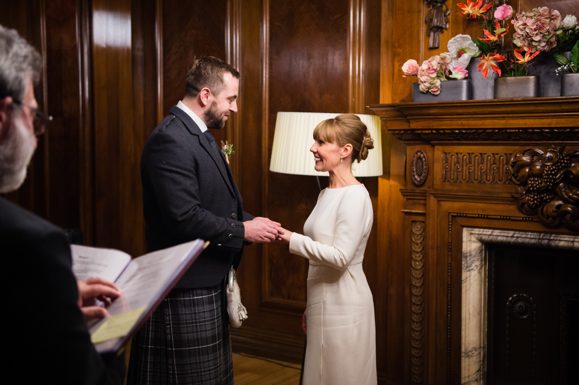 A couple exchanging rings on their wedding day